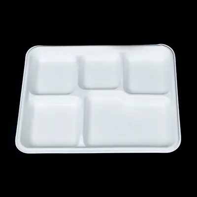 a white tray with four compartments